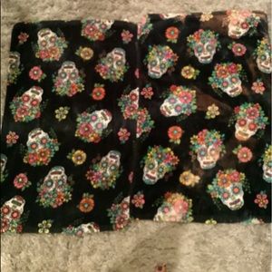 Isaac Mizrahi Hand Towels. Black with colored skull face pattern. 100% cotton